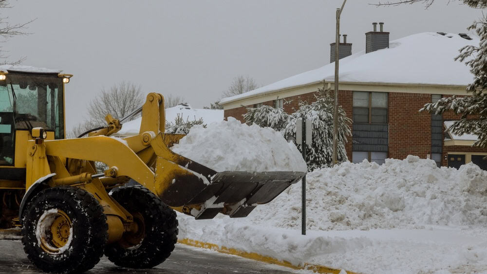 To remove snow from parking lot and road with truck it must be moved with truck