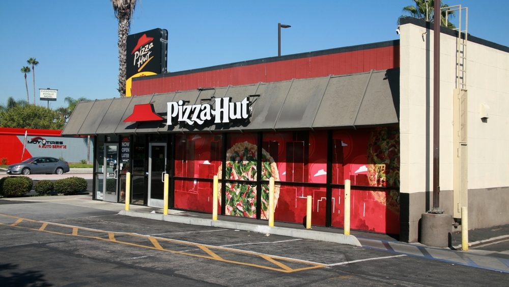 Santa Ana, California - USA - October 4, 2023: Pizza Hut is an American multinational restaurant chain and international franchise founded in 1958 in Wichita, Kansas by Dan and Frank Carney. Pizza. 