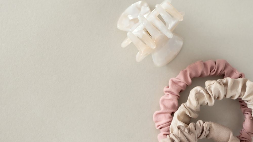Neutral minimal hair claw clip and hair ties close-up