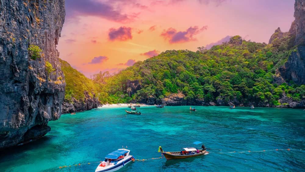 Aerial view of Nui beach and long tail boat in Phi Phi Don island, Krabi. Concept beauty nature of Thailand, travel Phuket.