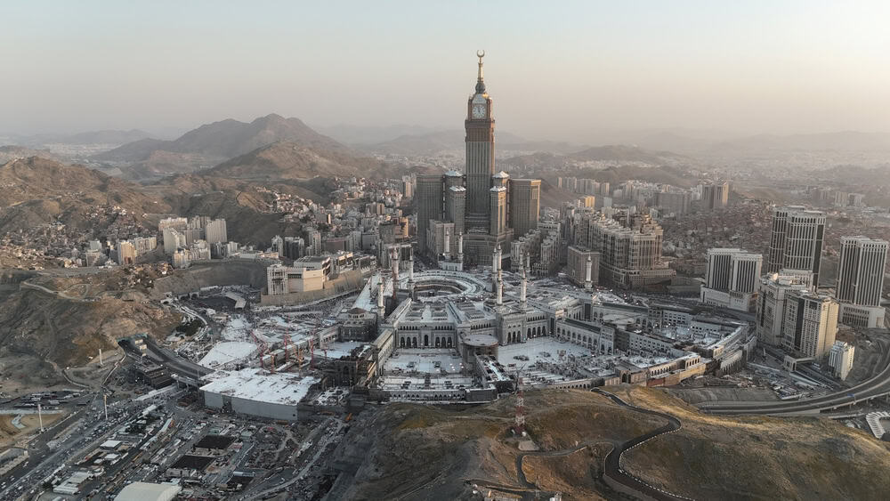 Mecca , Saudi Arabia Mars 30 2025: Makkah city Streets hotels and transportation Makkah Clock Tower - Masjid Al Haram drone aerial view