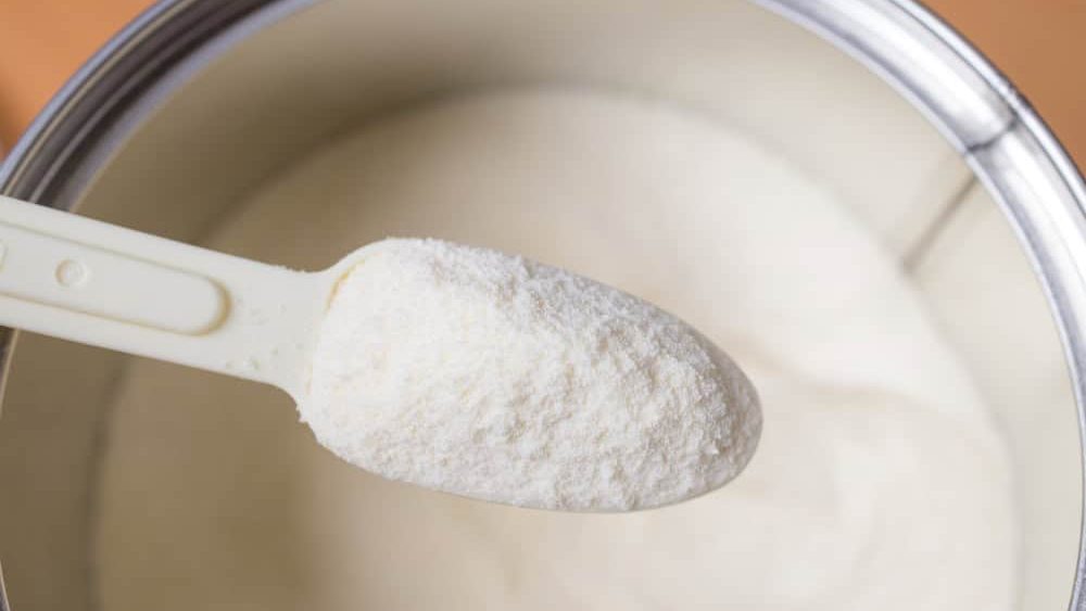 Healthy baby milk formula with plastic scoop