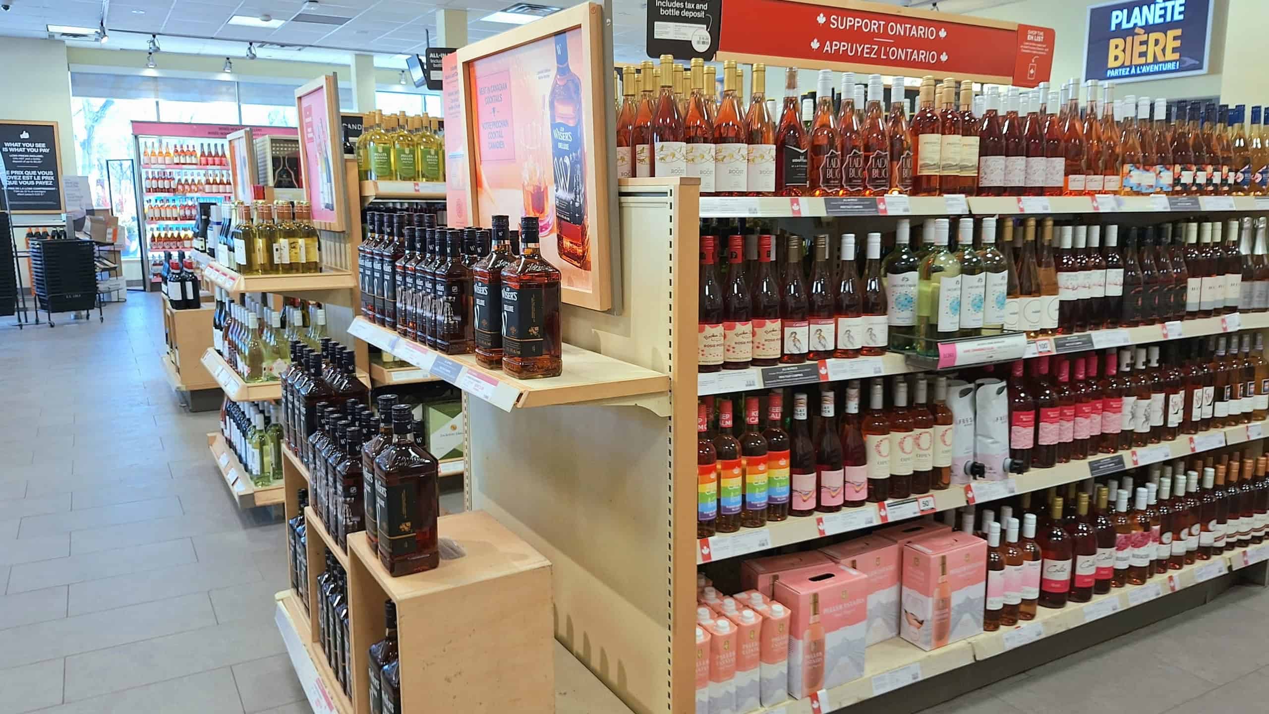 Toronto, ON, Canada - April 4, 2026: Bottles and boxes of wine fill the shelves at a liquor store location.