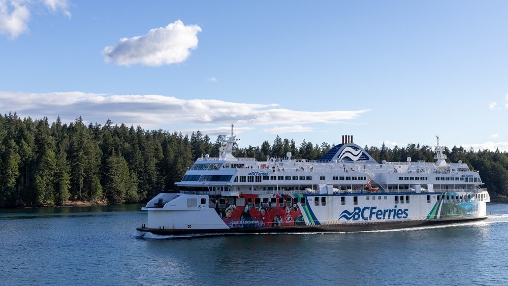 Gulf Islands, BC, Canada - June 26 2026: BC Ferries passenger ferry sailing past forested Gulf Islands in British Columbia.