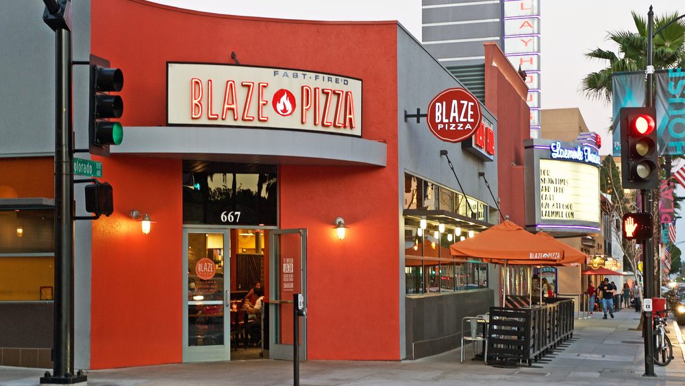  Building facade of the popular Blaze Pizza restaurant. Image was captured after sunset in Pasadena, California USA