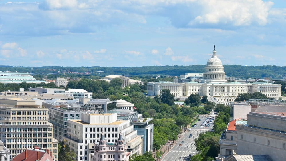 Washington D.C. - An aerial view of Pennsylvania Avenue with federal buildings including US Archives building, Department of Justice, FBI Headquarters and US Capitol Hill