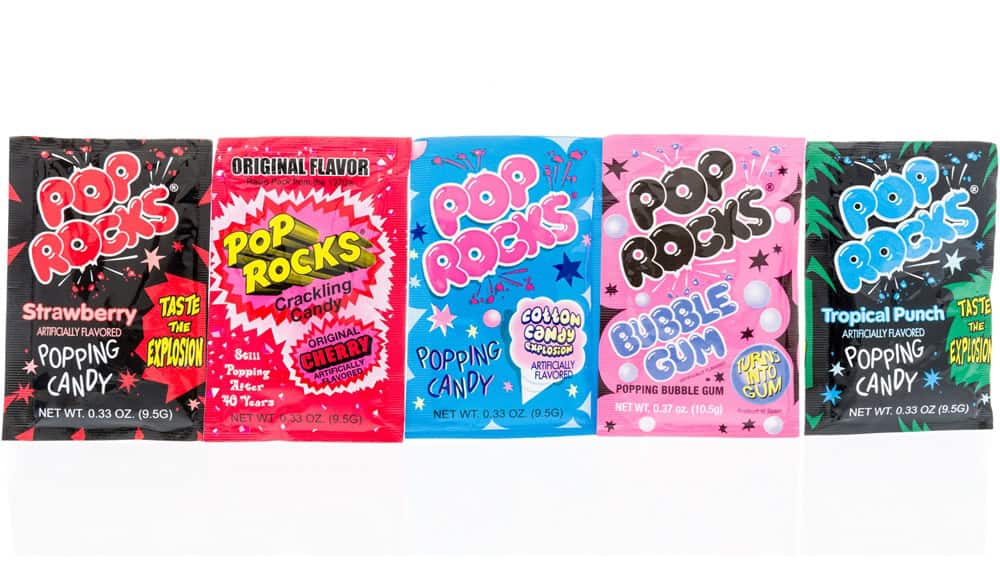 Winneconne, WI - 8 May 2018: A collection of Pop Rocks in strawberry, cherry, cotton candy, bubble gum flavor on an isolated background