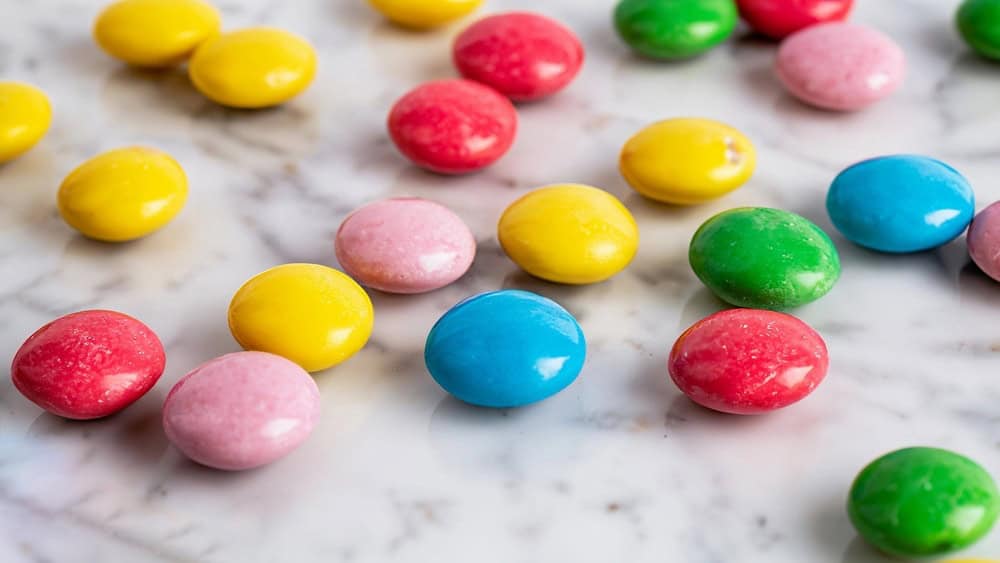 some smarties closeup on a white background
