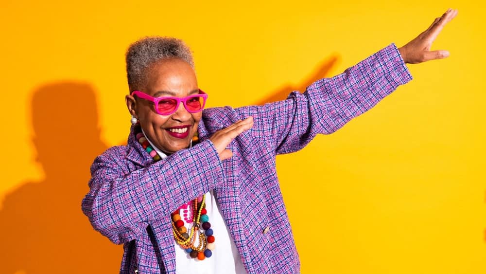 Colorful portrait of funny senior black woman wearing stylish clothing isolated in studio - Cool modern old female adult, concepts about elderly, senior people and body positive