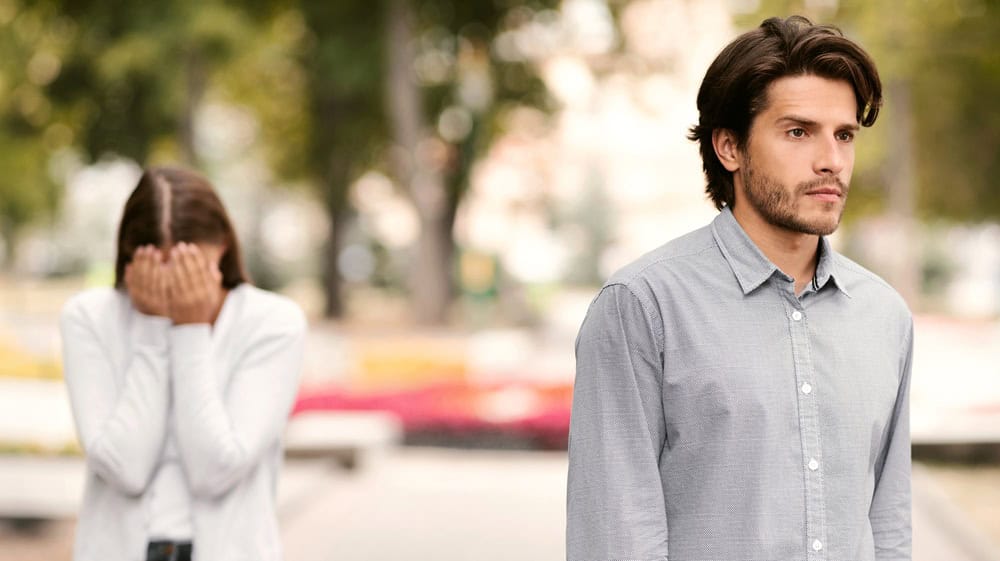 Break Up. Indifferent Boyfriend Leaving Crying Girlfriend Quitting Relationship Standing Outdoors. Selective Focus
