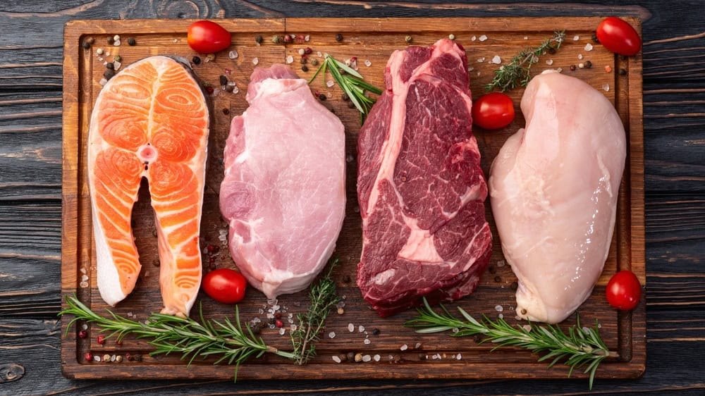 Mix of raw meat and fish . Salmon , beef , pork , chicken staek . Top view photography