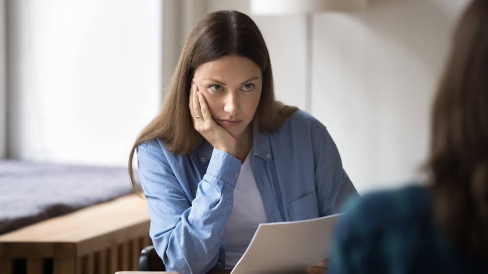 HR conduct job interview, listen, evaluate not trustworthy candidate responses, review qualification, feel dissatisfied with bad first impression, negative attitude to applicant, unsuccessful staffing
