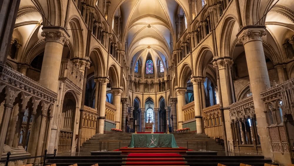 CANTERBURY, UNITED KINGDOM, OCTOBER 1st 2024: Main altar of Canterbury Cathedral among luxurious gothic architectural details. Stunning interior with vaulted ceiling and stained glass windows.