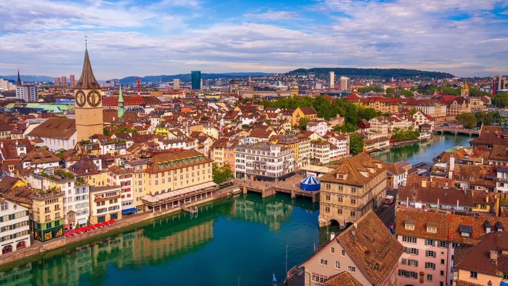 Zurich, Switzerland historic cityscape on the Limmat River on a beautiful day.