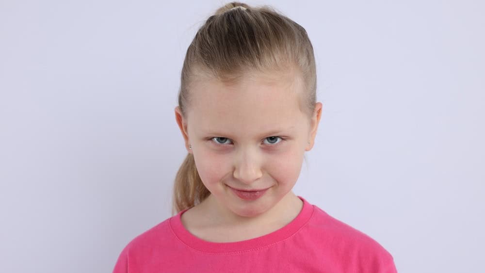 Portrait of little girl on white background