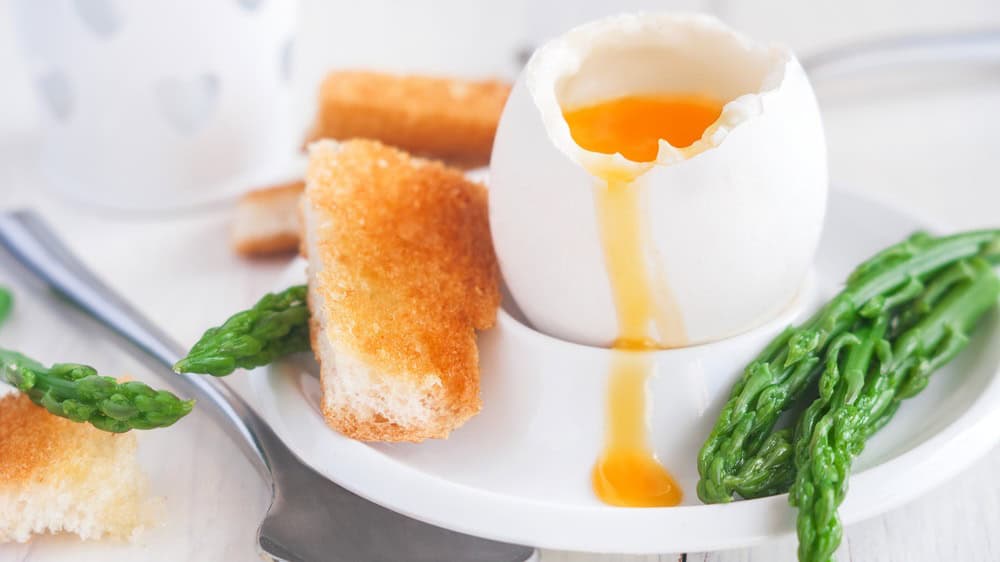 Soft boiled eggs with asparagus and toast soldiers