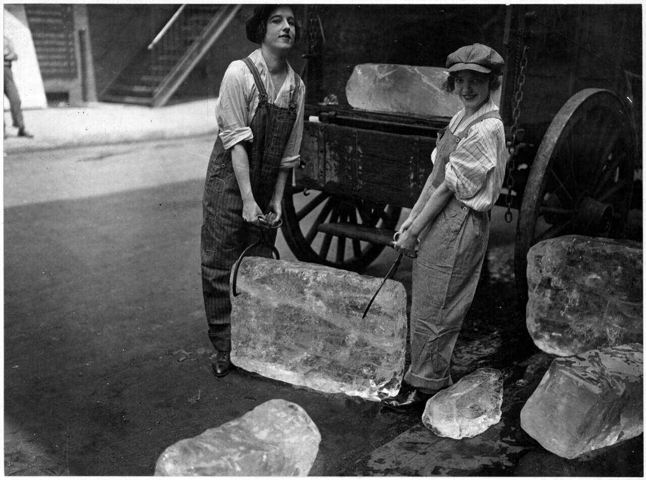 Girls deliver ice. Heavy work that formerly belonged to men only is being done by girls. The ice girls are delivering... - NARA - 533758