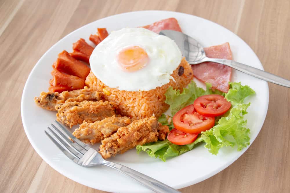American fried rice in white plate. It is fried rice in Thailand for American soldier 