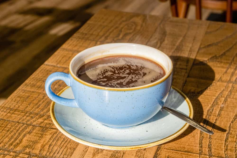 07.03.2023 Windermere, Cumbria, UK. Americano is a type of coffee drink prepared by diluting an espresso with hot water, giving it a similar strength to, but different flavor 