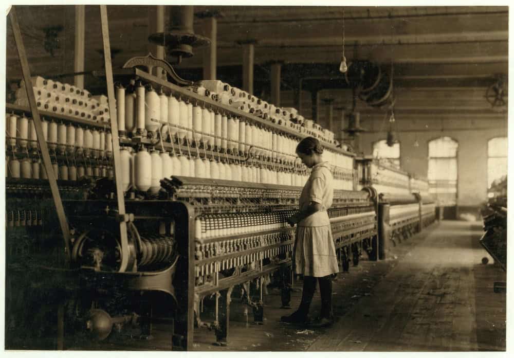 Lewis Hine's photographic collection. Fourteen year old spinner in a Brazos Valley Cotton Mill at West. NOVEMBER 1913 - USA
