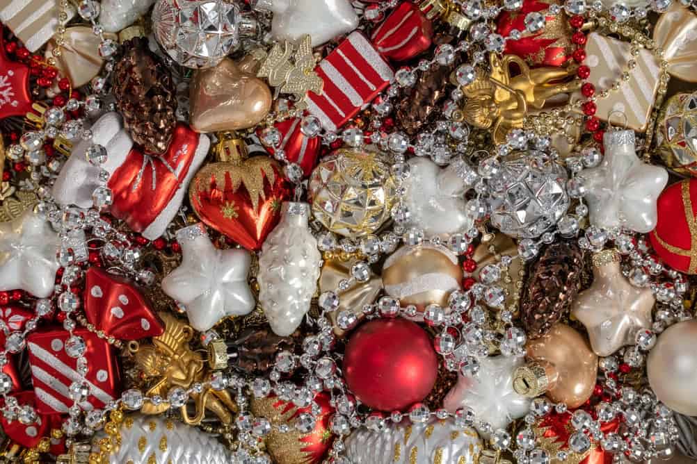 Vintage Christmas Glass Ornaments Heart Stars And Pine Cones With Silver Garland. Red White And Gold Holiday Flat Lay Top View. Festive Background Vertical